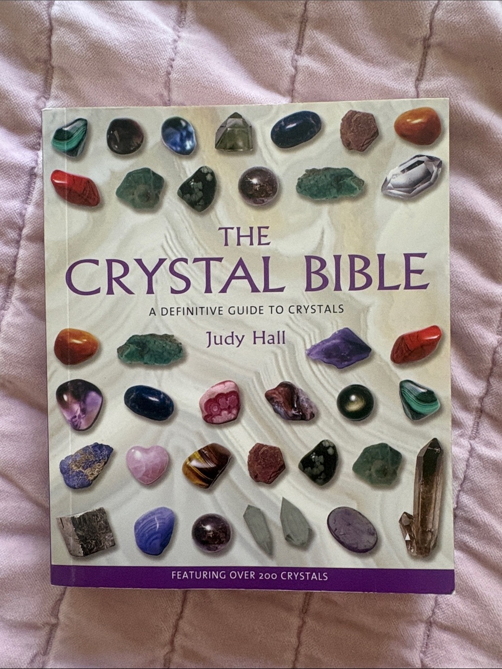 The Crystal Bible by Judy Hall — White Cover with Multicolored Stones